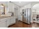 Well-appointed kitchen with stainless steel appliances, white cabinetry, and open layout to dining area at 116 Rainbow Trout Trl, Fort Mill, SC 29715