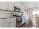 Modern kitchen with stainless steel appliances, white cabinets, and granite countertops at 116 Rainbow Trout Trl, Fort Mill, SC 29715