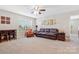 Spacious loft features a comfortable seating area with good lighting and wood floors at 116 Rainbow Trout Trl, Fort Mill, SC 29715