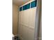 Built-in storage with white cabinets and blue storage bins provides ample space for organization and a clean look at 116 Rainbow Trout Trl, Fort Mill, SC 29715
