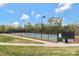Well-maintained community tennis court surrounded by greenery and well-maintained landscaping for residents at 116 Rainbow Trout Trl, Fort Mill, SC 29715