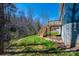 The backyard features a wooden deck with stairs and a retaining wall at 1314 39Th Street Sw Cir, Hickory, NC 28602