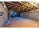 Unfinished basement with concrete block walls and exposed ceiling at 1314 39Th Street Sw Cir, Hickory, NC 28602