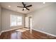Bedroom features wood-look floors and a modern ceiling fan at 1314 39Th Street Sw Cir, Hickory, NC 28602
