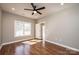 Bedroom features wood-look floors and a modern ceiling fan at 1314 39Th Street Sw Cir, Hickory, NC 28602
