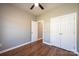 Bedroom with ceiling fan, wood-look floors, and a spacious closet at 1314 39Th Street Sw Cir, Hickory, NC 28602