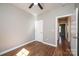 A minimalist bedroom features wood-look flooring, a ceiling fan, and white walls at 1314 39Th Street Sw Cir, Hickory, NC 28602