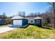 Charming single-story home with a two-car garage, surrounded by lush green lawn and trees at 1314 39Th Street Sw Cir, Hickory, NC 28602