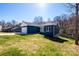 Inviting blue home with white trim, set on a lush green lawn in a tranquil, wooded neighborhood at 1314 39Th Street Sw Cir, Hickory, NC 28602