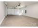 Spacious garage with white walls, ample lighting, and garage door at 1314 39Th Street Sw Cir, Hickory, NC 28602