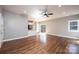 Spacious living room featuring hardwood floors, recessed lighting, and access to the kitchen and outdoor deck at 1314 39Th Street Sw Cir, Hickory, NC 28602
