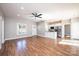 Open living space with hardwood floors seamlessly connecting the living area and the kitchen at 1314 39Th Street Sw Cir, Hickory, NC 28602