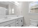 Full bathroom with double sinks, white countertops, and a toilet at 13712 Bonnerby Ct, Huntersville, NC 28078