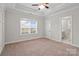 Bedroom with carpet and an entrance to a full bathroom at 13712 Bonnerby Ct, Huntersville, NC 28078