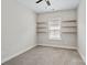 Bedroom with carpet, shelving, and a window at 13712 Bonnerby Ct, Huntersville, NC 28078