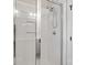 Shower with a frameless glass door, white tile, and chrome fixtures at 13712 Bonnerby Ct, Huntersville, NC 28078