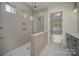 Modern bathroom features a glass-enclosed shower and stylish tile flooring at 1378 Cedardale Ln, Denver, NC 28037