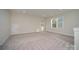 Spacious bonus room with two large windows and neutral carpet at 1378 Cedardale Ln, Denver, NC 28037