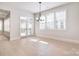 Bright dining room with hardwood floors, white trim, and large windows at 1378 Cedardale Ln, Denver, NC 28037
