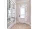 Bright entryway with hardwood floors, white trim, and french doors at 1378 Cedardale Ln, Denver, NC 28037
