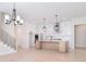 Elegant kitchen with white cabinets, a large island, and a modern design at 1378 Cedardale Ln, Denver, NC 28037