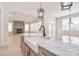 A stunning kitchen with stainless steel appliances, marble countertops, a sink and a view to the Gathering room at 1378 Cedardale Ln, Denver, NC 28037