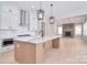Beautiful open kitchen with stainless steel appliances, island, and view to the Gathering room fireplace at 1378 Cedardale Ln, Denver, NC 28037