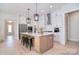Beautiful kitchen features stainless steel appliances, a spacious island, and modern pendant lighting at 1378 Cedardale Ln, Denver, NC 28037