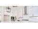 Modern kitchen with white cabinets, stainless steel appliances, subway tile backsplash, and marble countertops at 1378 Cedardale Ln, Denver, NC 28037