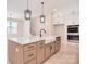 Kitchen island with marble countertops and a farmhouse sink at 1378 Cedardale Ln, Denver, NC 28037