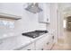 Bright, modern kitchen features stainless steel range and hood with marble countertops at 1378 Cedardale Ln, Denver, NC 28037