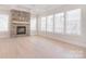 Living room boasts a stone fireplace and bright windows at 1378 Cedardale Ln, Denver, NC 28037