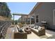 Relaxing outdoor patio with comfortable seating, a pergola, and a serene setting at 1378 Cedardale Ln, Denver, NC 28037