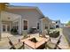 Inviting outdoor space featuring a fire pit, comfortable seating, and a well-maintained yard at 1378 Cedardale Ln, Denver, NC 28037