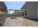 Stylish outdoor patio featuring a pergola, fire pit, and patterned concrete, perfect for entertaining at 1378 Cedardale Ln, Denver, NC 28037