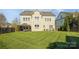Spacious backyard with a well-manicured lawn and a covered patio, great for outdoor gatherings at 15402 Country Lake Dr, Pineville, NC 28134