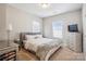 Bright bedroom featuring a calm color palette and large windows for plenty of natural light at 15402 Country Lake Dr, Pineville, NC 28134