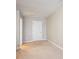 Vacant bedroom with carpet, neutral walls, and a door leading to other parts of the house at 15402 Country Lake Dr, Pineville, NC 28134