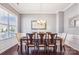 Elegant dining room featuring hardwood floors, crown molding, and a stylish chandelier above table at 15402 Country Lake Dr, Pineville, NC 28134