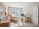 Bright home office with multiple desk spaces and comfortable seating area at 15402 Country Lake Dr, Pineville, NC 28134