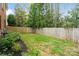 Fenced backyard featuring well-maintained lawn and shrubbery and providing privacy and space for outdoor activities at 1736 Cavendale Dr, Rock Hill, SC 29732