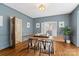Sophisticated dining room with hardwood floors, shuttered windows, and a stylish table setting for intimate meals at 1736 Cavendale Dr, Rock Hill, SC 29732