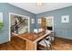 Formal dining room with elegant wainscoting, a large wood table, and access to other rooms, ideal for hosting gatherings at 1736 Cavendale Dr, Rock Hill, SC 29732