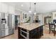 Spacious kitchen features a large island, stainless steel appliances, and custom cabinets for modern functionality at 1736 Cavendale Dr, Rock Hill, SC 29732