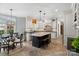 Open-concept kitchen with a large island, bar seating, and adjacent dining area, perfect for entertaining and Gathering meals at 1736 Cavendale Dr, Rock Hill, SC 29732