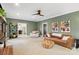 The living room has a ceiling fan, stylish decor, and opens to other areas of the house at 1736 Cavendale Dr, Rock Hill, SC 29732