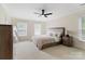 A spacious main bedroom featuring soft carpeting and plenty of natural light at 1736 Cavendale Dr, Rock Hill, SC 29732
