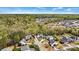 An aerial view of a neighborhood nestled among lush greenery and trees at 1840 Sapona Ct, Denver, NC 28037