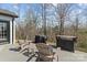 Backyard deck with multiple chairs, grill and view of the woods at 1840 Sapona Ct, Denver, NC 28037