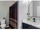The bathroom features a vanity with marble countertops, a black faucet, and black accents at 1840 Sapona Ct, Denver, NC 28037